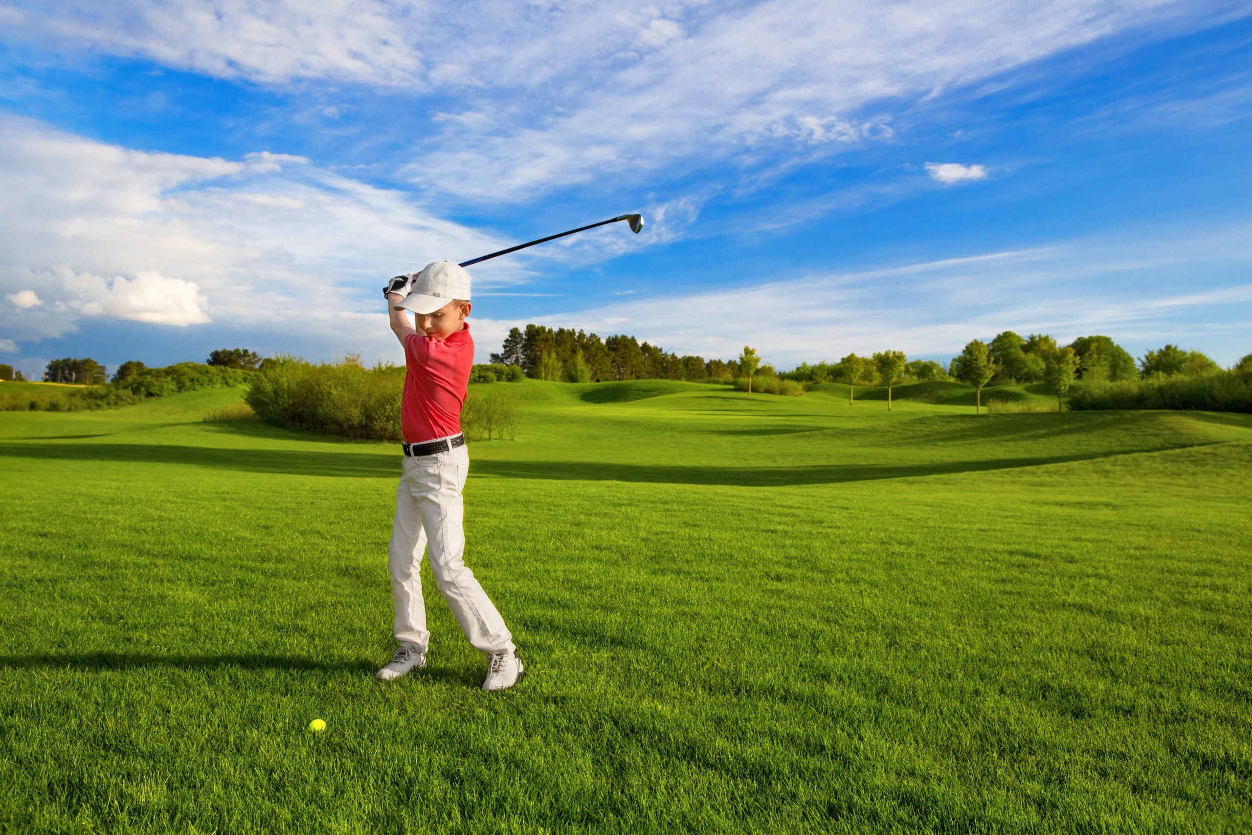 Boy playing golf